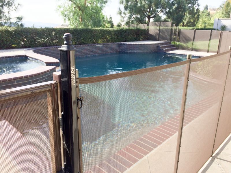 Mesh Fence Secured Around Pool